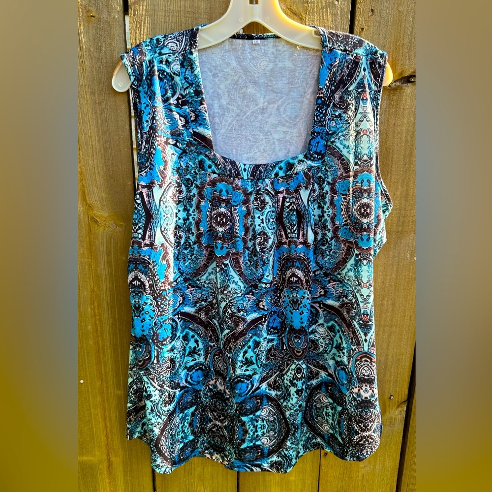 Women’s paisley blue/aqua sleeveless blouse, NWOT, 95% polyeste, 1X or XXL.